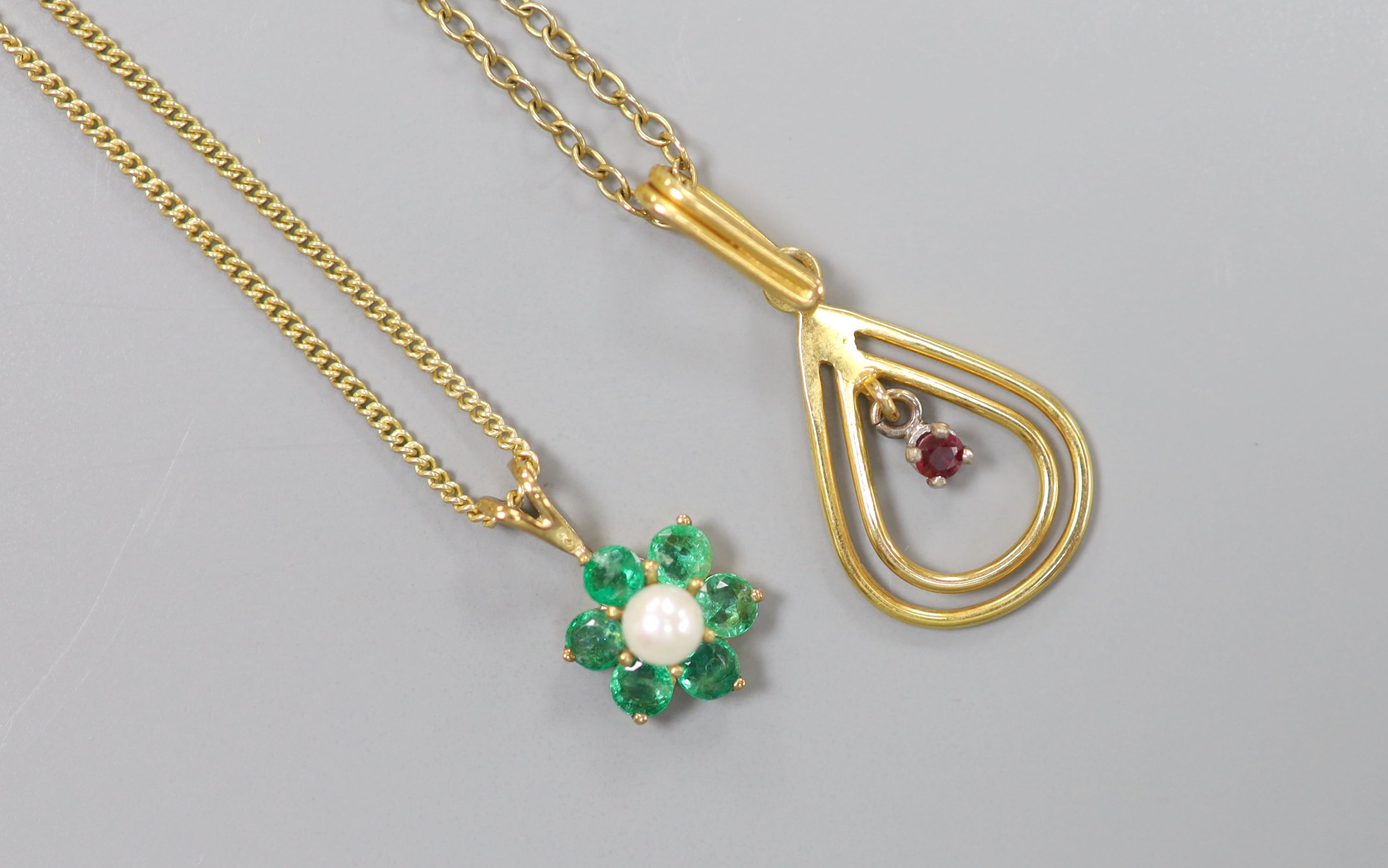 Two modern 9ct gold and gem set pendants on 9ct chains, including emerald & seed pearl cluster, 7mm